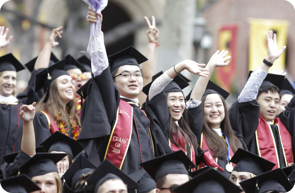 international students celebrate their university graduation ceremony, wearing the classic USA cap and gown outfit